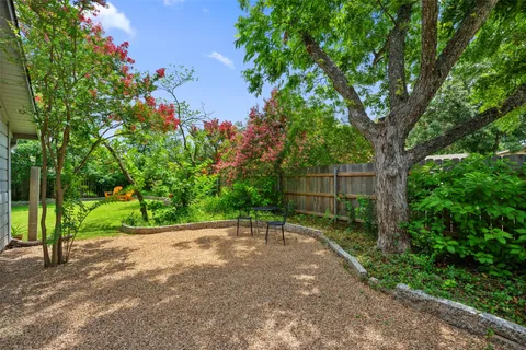 a view of a backyard with a small cabin