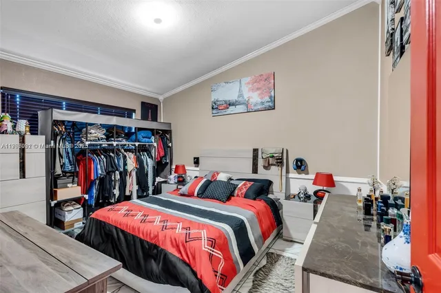 a bed room with a bed and a walk in closet