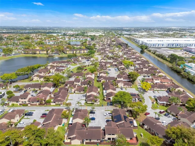 an aerial view of residential building and lake