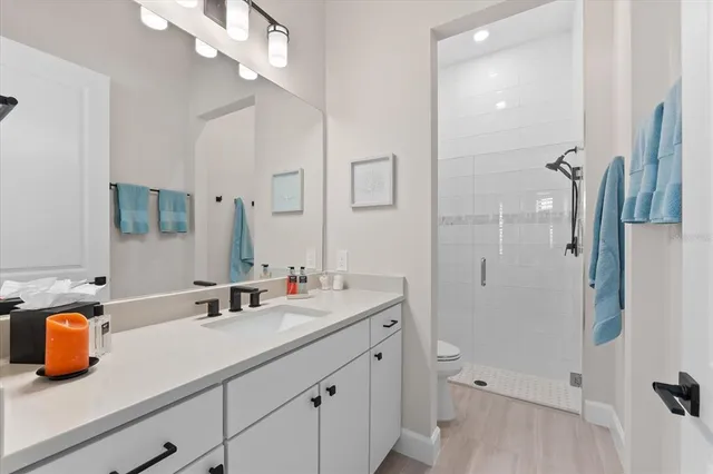 a view of a patio with table and chairs under an umbrella