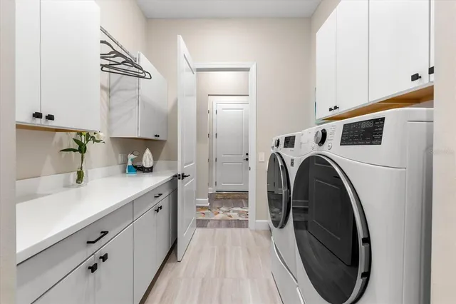 a living room with lots of furniture and a flat screen tv