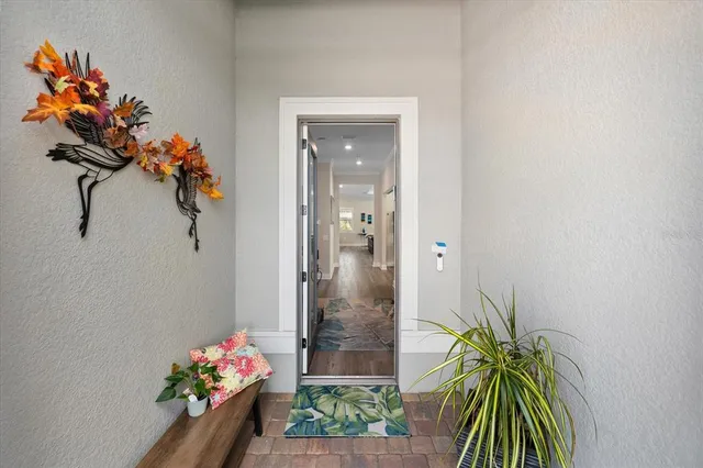 a view of kitchen with stainless steel appliances kitchen island microwave and cabinets