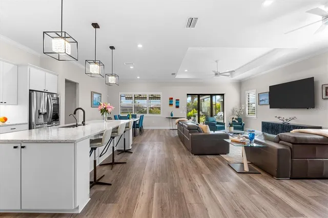 a kitchen with stainless steel appliances granite countertop a stove and a microwave