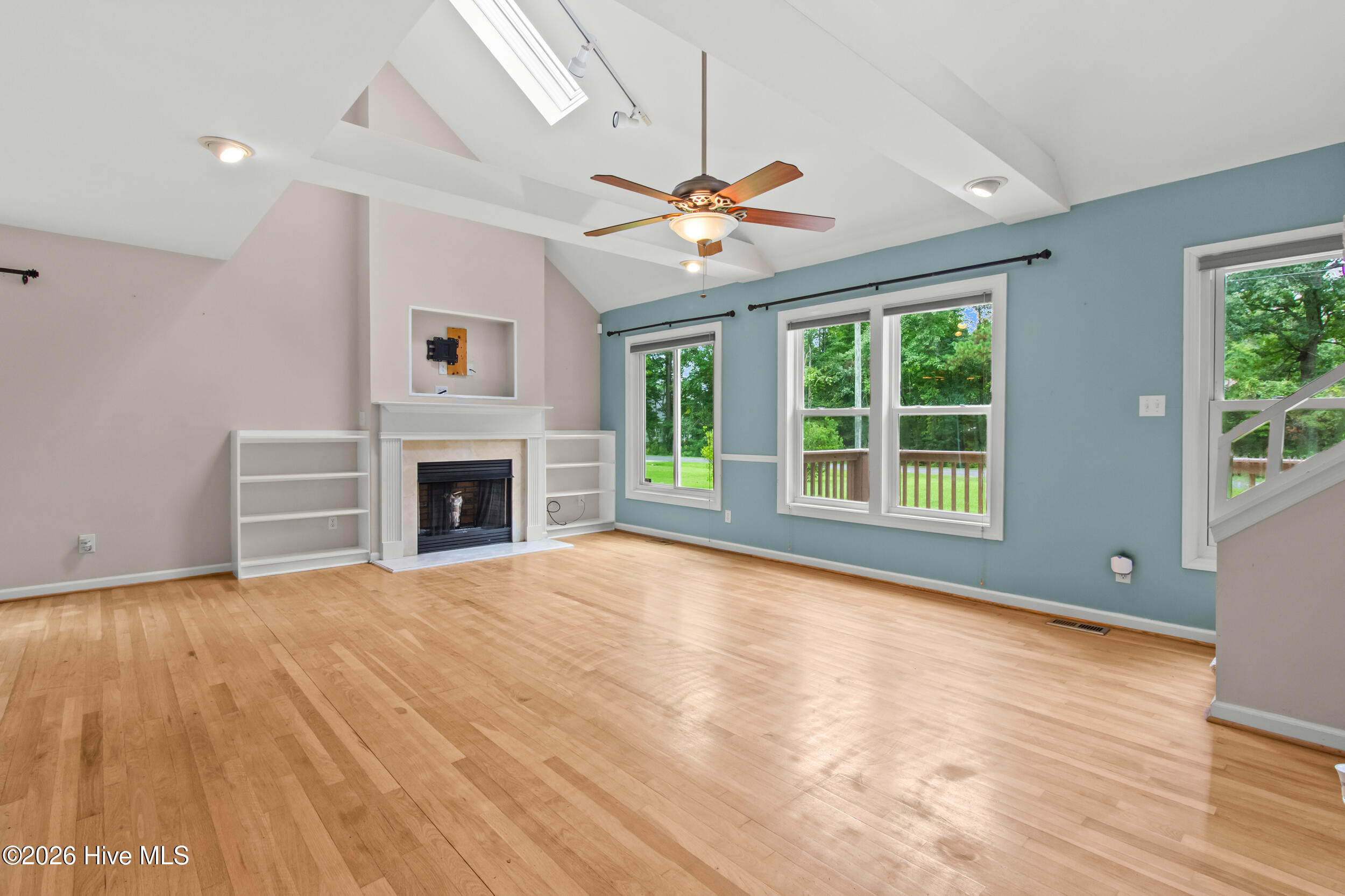 105 Crump Farm Road New Bern, NC 28562 - Photo 6 of 44 Living Room with Fireplace and Built-In Shelving