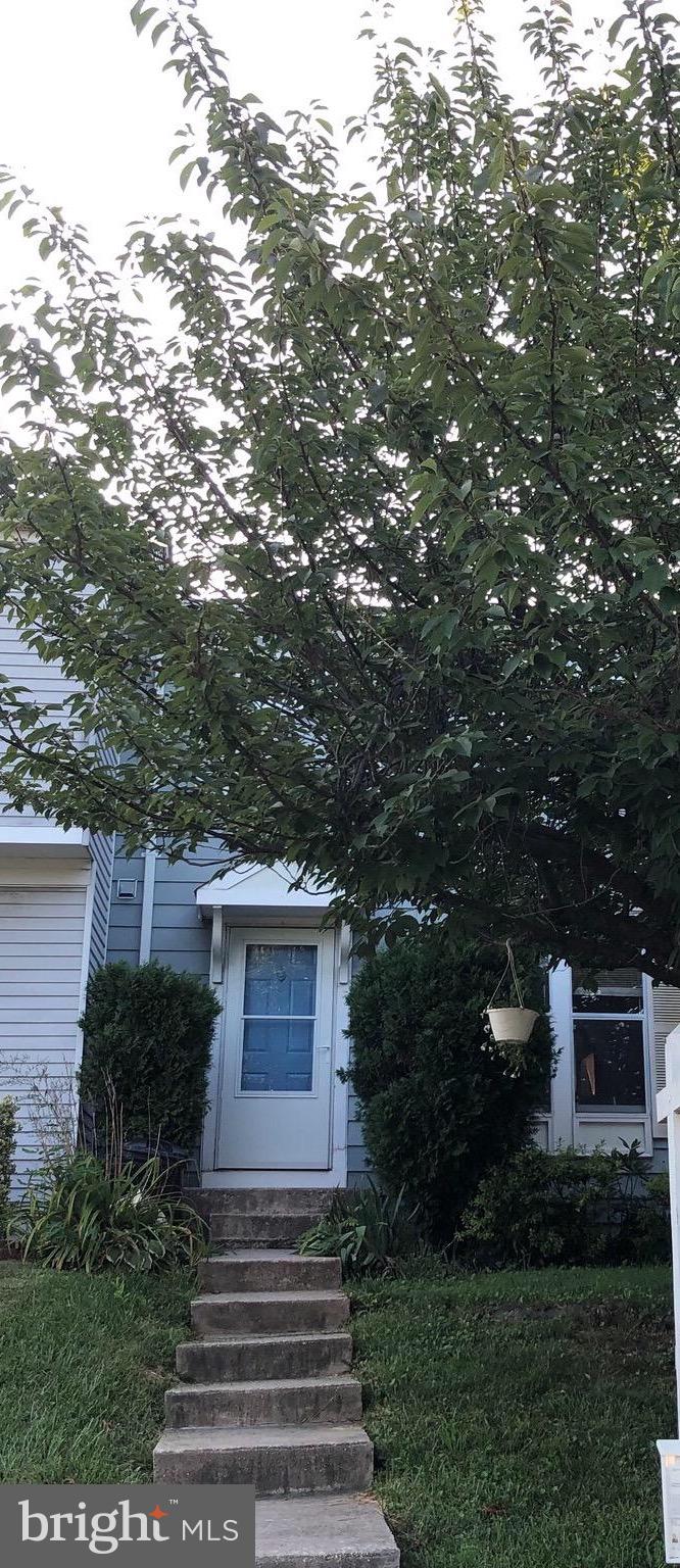 4 Hyacinth Road Baltimore, MD 21234 - Photo 2 of 33 a front view of a house with garden