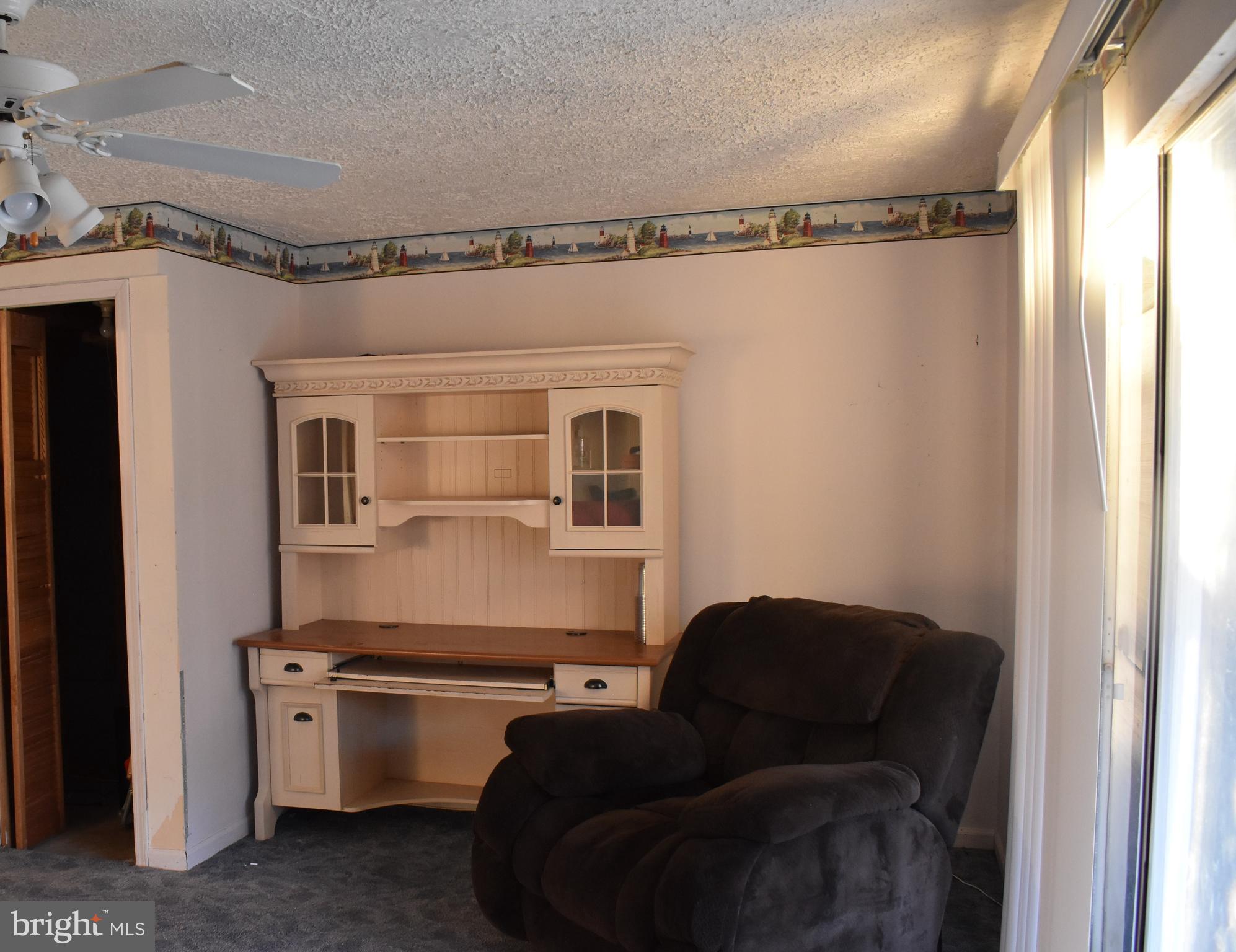4 Hyacinth Road Baltimore, MD 21234 - Photo 16 of 33 a living room with furniture and a gate