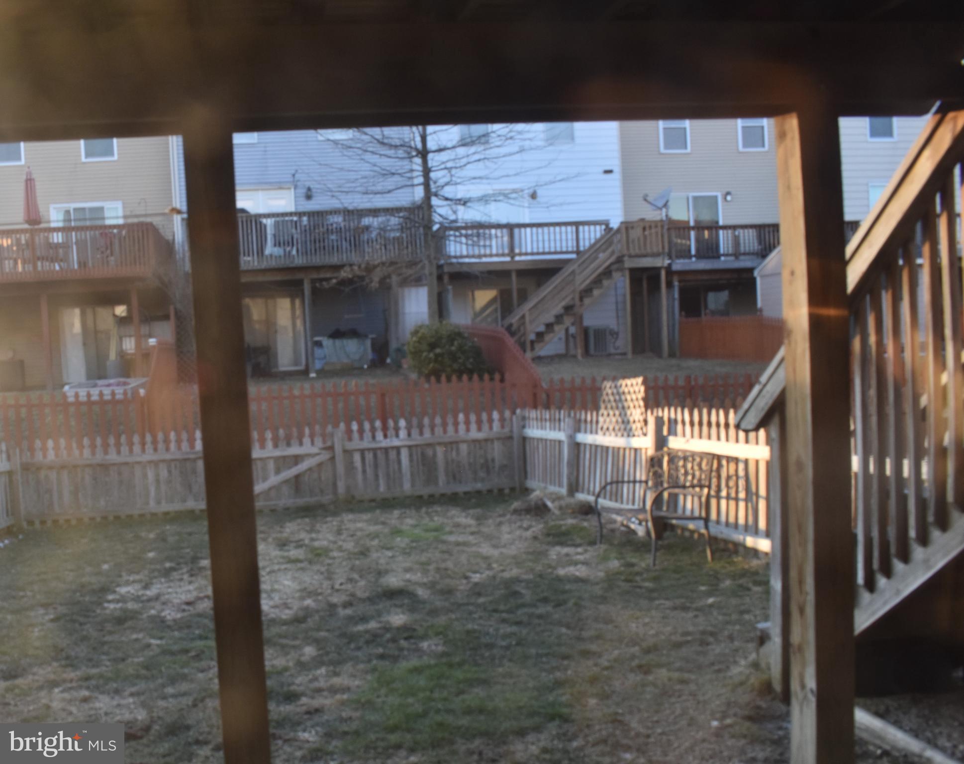 4 Hyacinth Road Baltimore, MD 21234 - Photo 18 of 33 a view of a house with a small yard and wooden fence