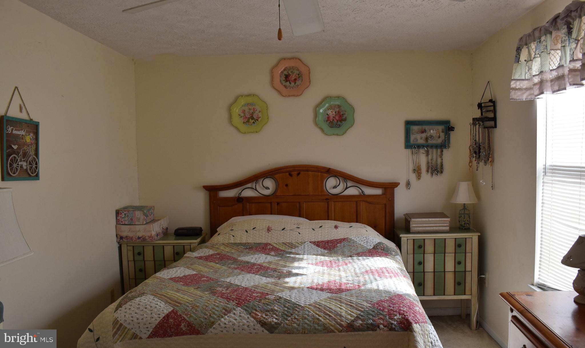4 Hyacinth Road Baltimore, MD 21234 - Photo 21 of 33 a bedroom with a bed and a window