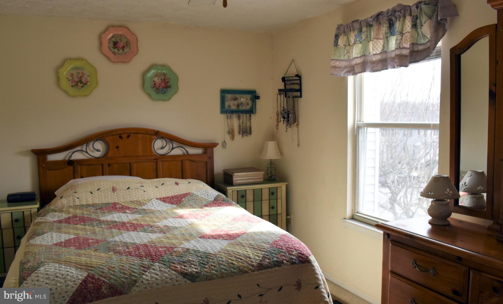 4 Hyacinth Road Baltimore, MD 21234 - Photo 22 of 33 a bedroom with a bed and a window