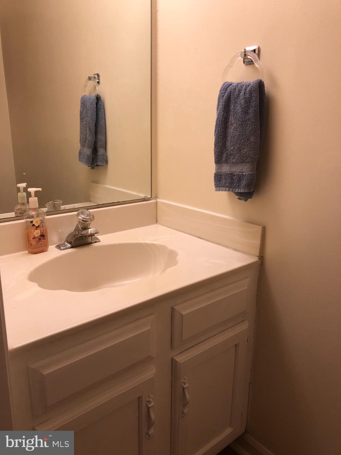 4 Hyacinth Road Baltimore, MD 21234 - Photo 7 of 33 a bathroom with a sink and a mirror