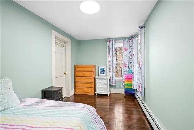 a bedroom with a bed and a bookshelf