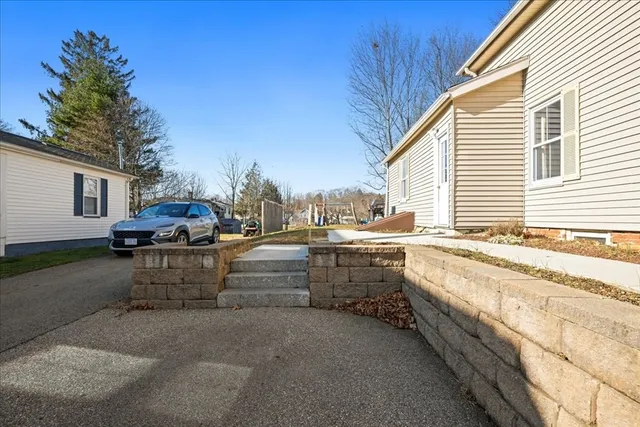 a swimming pool with outdoor seating and yard