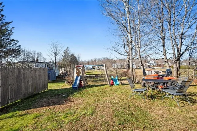a view of a park with swings and slides