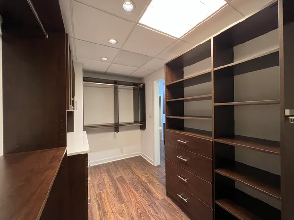 a view of an empty walk in closet