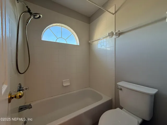 a view of backyard with patio