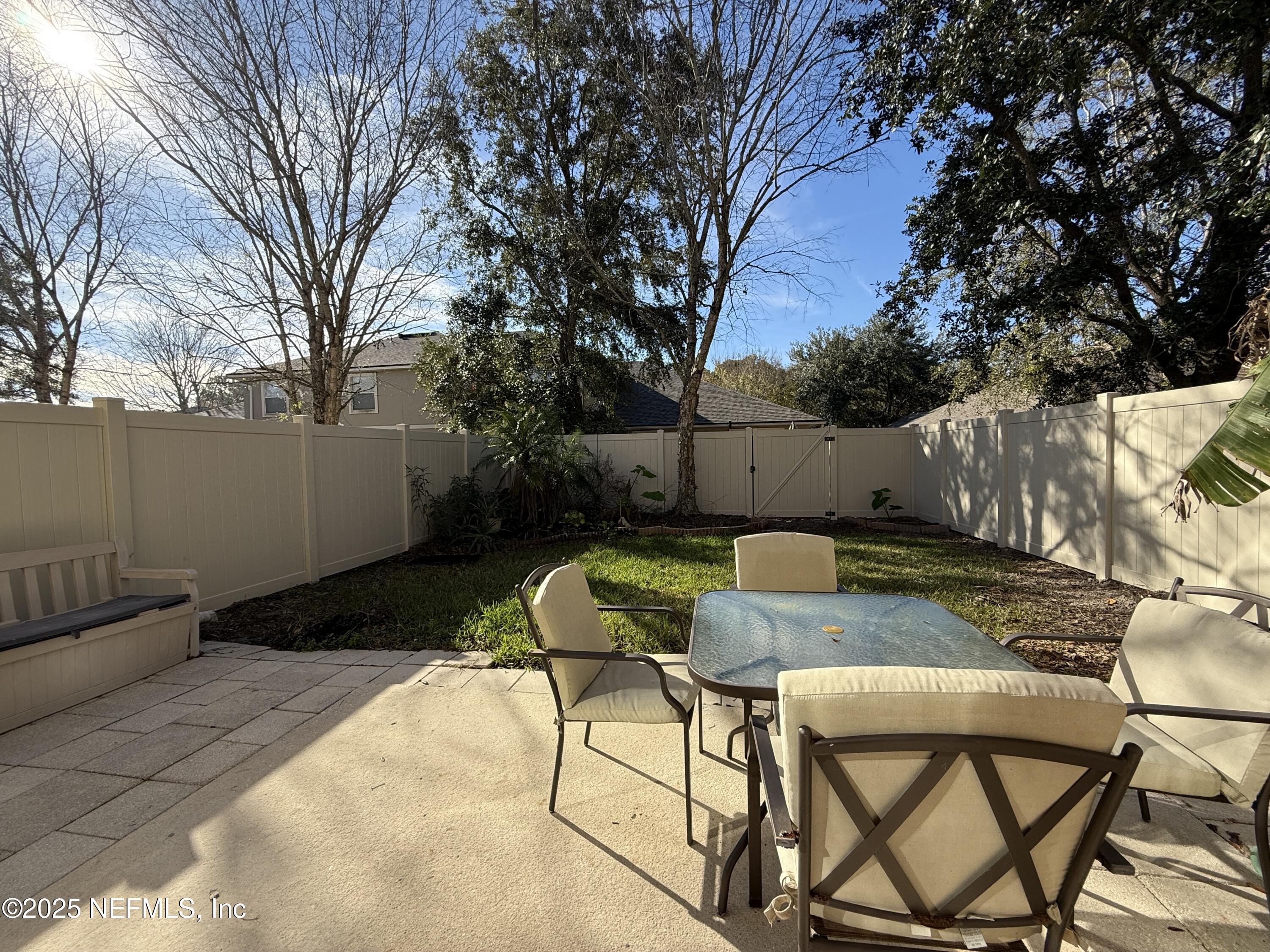1865 Green Springs Circle, Unit C Fleming Island, FL 32003 - Photo 21 of 29 a view of backyard with patio