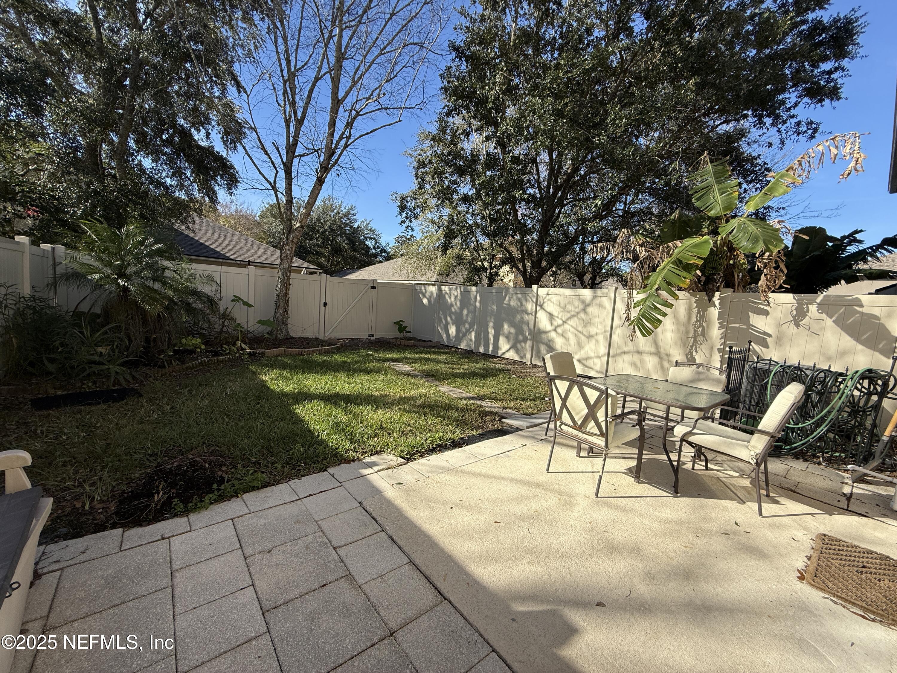 1865 Green Springs Circle, Unit C Fleming Island, FL 32003 - Photo 23 of 29 a view of a backyard with a patio