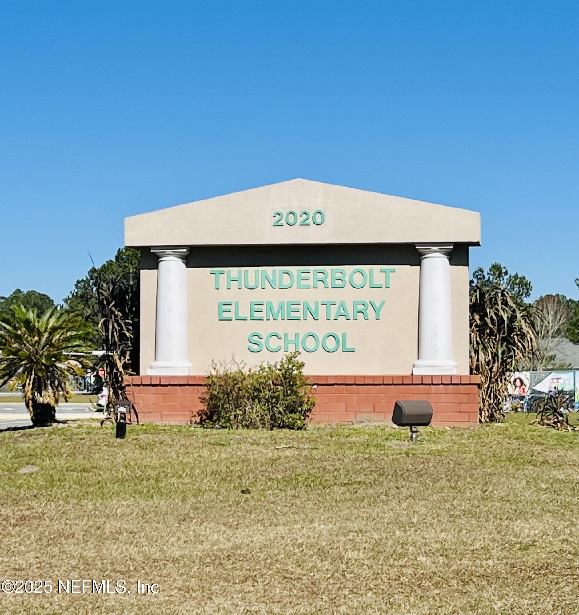 1865 Green Springs Circle, Unit C Fleming Island, FL 32003 - Photo 24 of 29 a front view of a house with garden