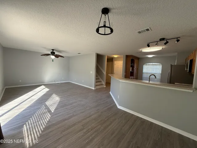 a bathroom with a sink vanity mirror and toilet