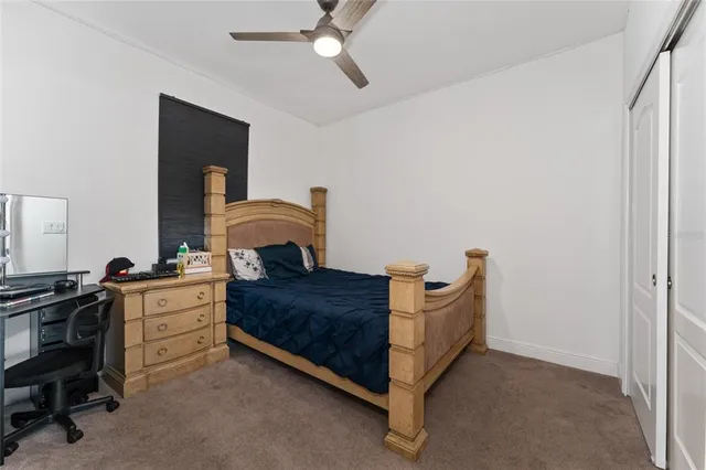 a bed room with a bed and a dresser