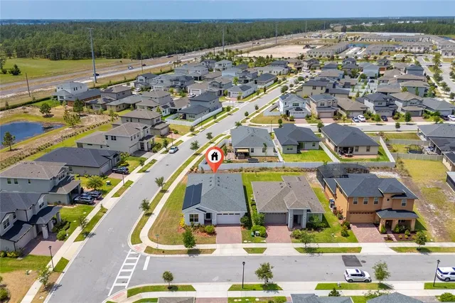 a view of multiple houses with yard