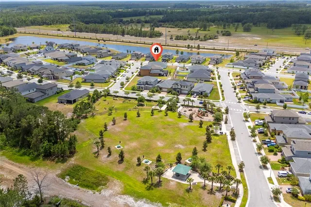 an aerial view of residential houses with outdoor space