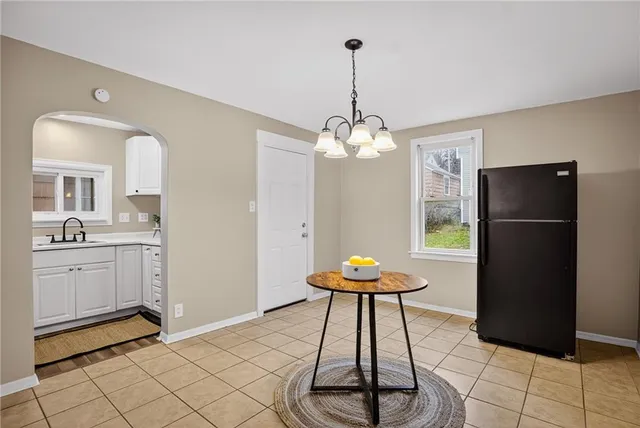 a kitchen with sink a stove and cabinets