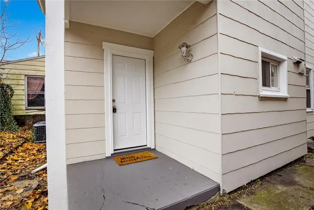 a front view of house with yard and porch