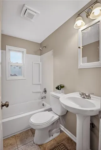 a kitchen with a sink and a refrigerator