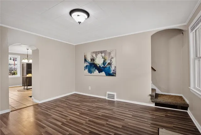 a room with chandelier and a table