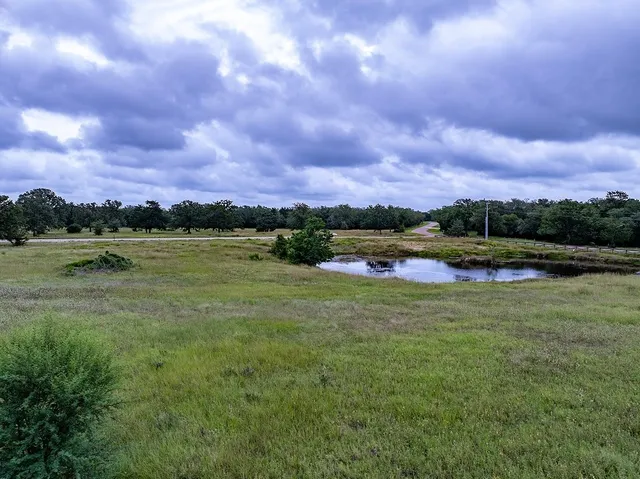 a view of a lake with houses in the back