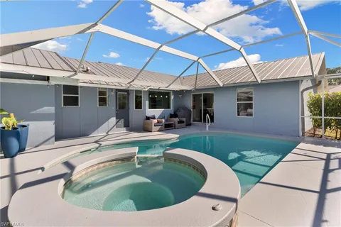 a view of pool with outdoor seating