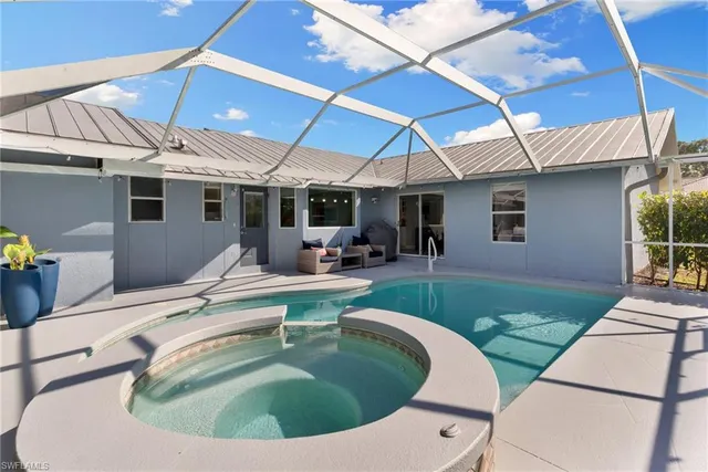 a view of pool with outdoor seating