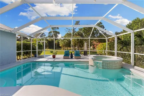 a view of a swimming pool with a patio