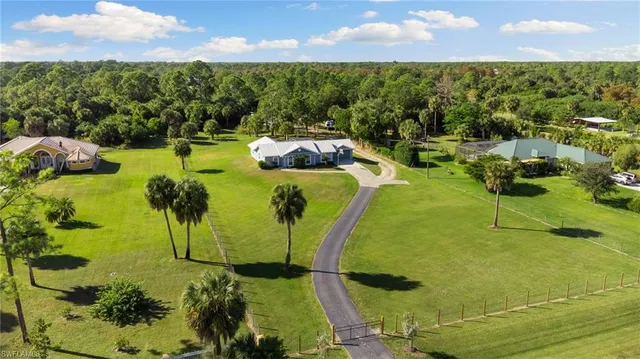 a view of a swimming pool with a yard