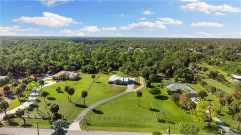 an aerial view of a residential houses with outdoor space