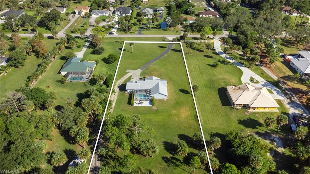 1061 15th Street Southwest Naples, FL 34117 - Photo 42 of 47 an aerial view of a house with a yard