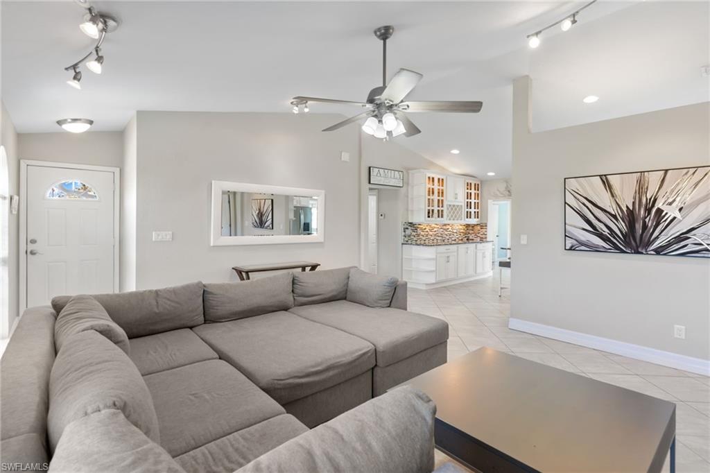 1061 15th Street Southwest Naples, FL 34117 - Photo 8 of 47 a living room with furniture and a ceiling fan