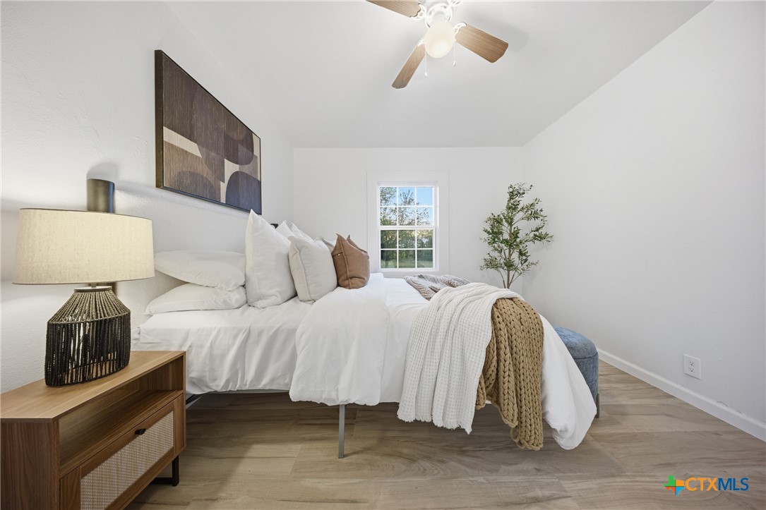 918 Fannin Loop Temple, TX 76501 - Photo 18 of 31 a bedroom with a bed and a lamp