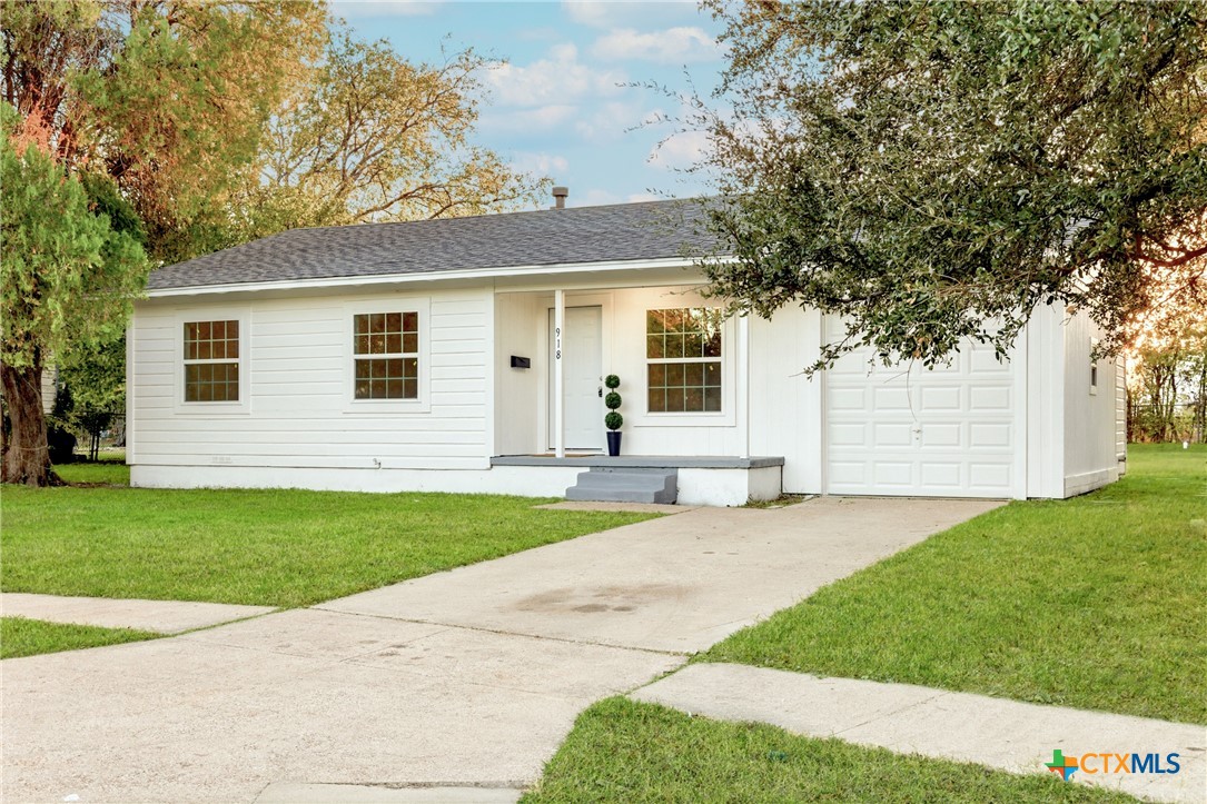 918 Fannin Loop Temple, TX 76501 - Photo 2 of 31 a front view of a house with a yard and garage