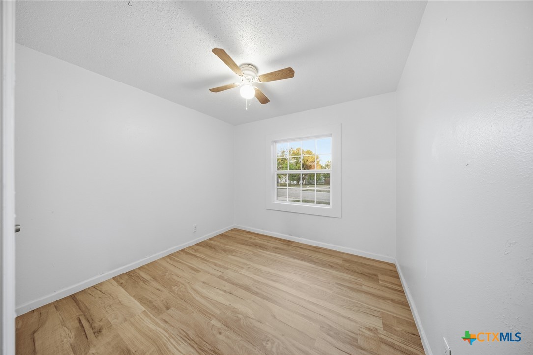 918 Fannin Loop Temple, TX 76501 - Photo 24 of 31 an empty room with a window and ceiling fan