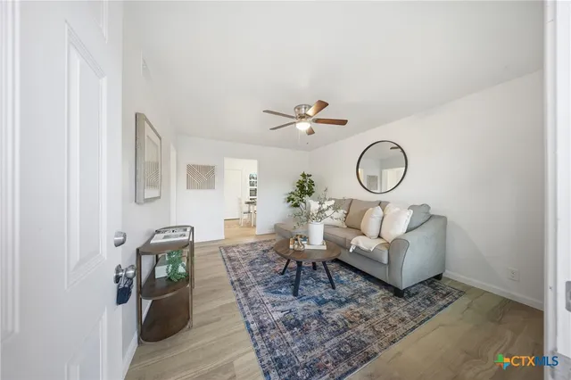 a living room with furniture and a rug