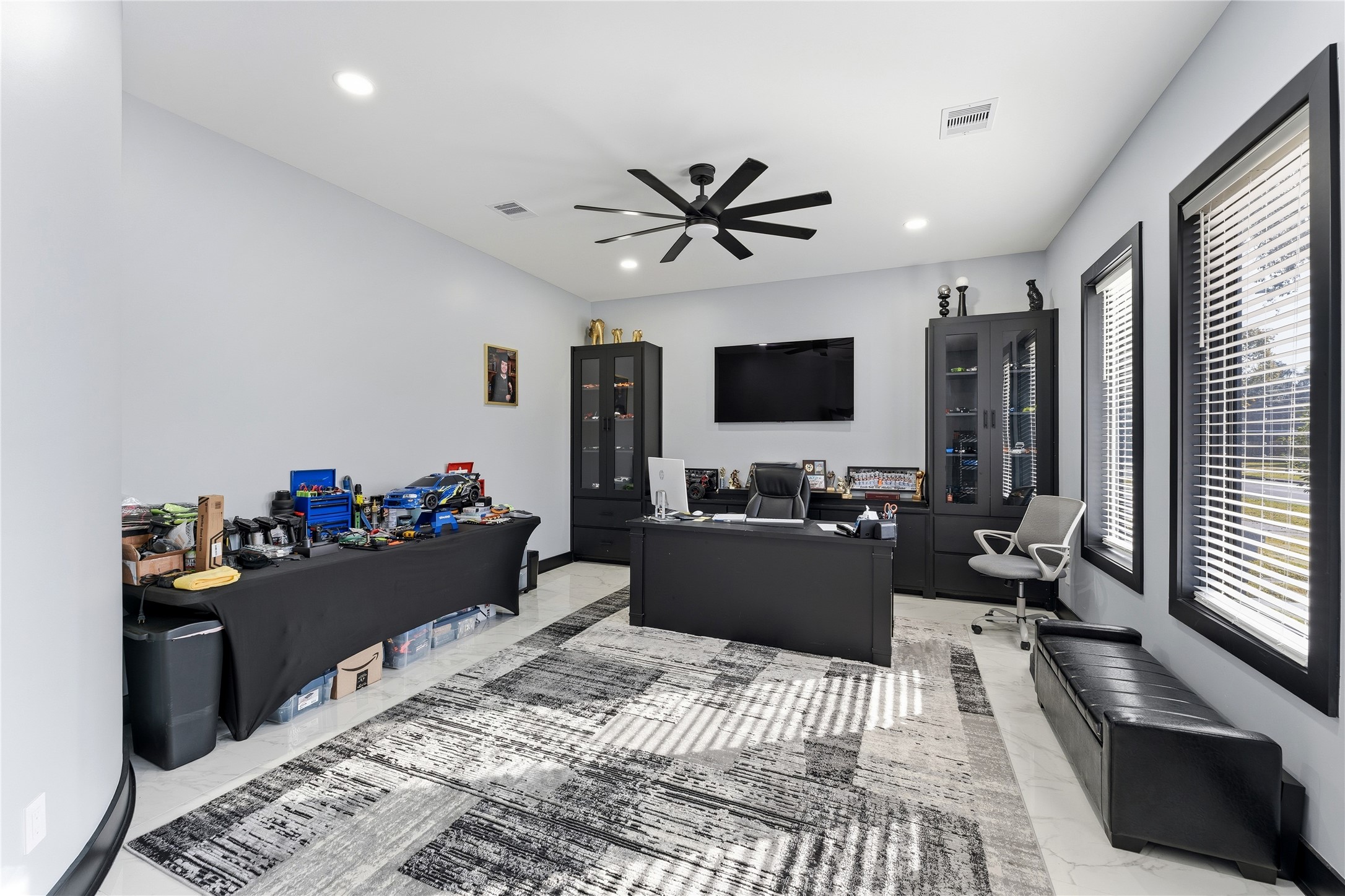7737 Edna Street Houston, TX 77087 - Photo 16 of 43 a living room with furniture and a flat screen tv