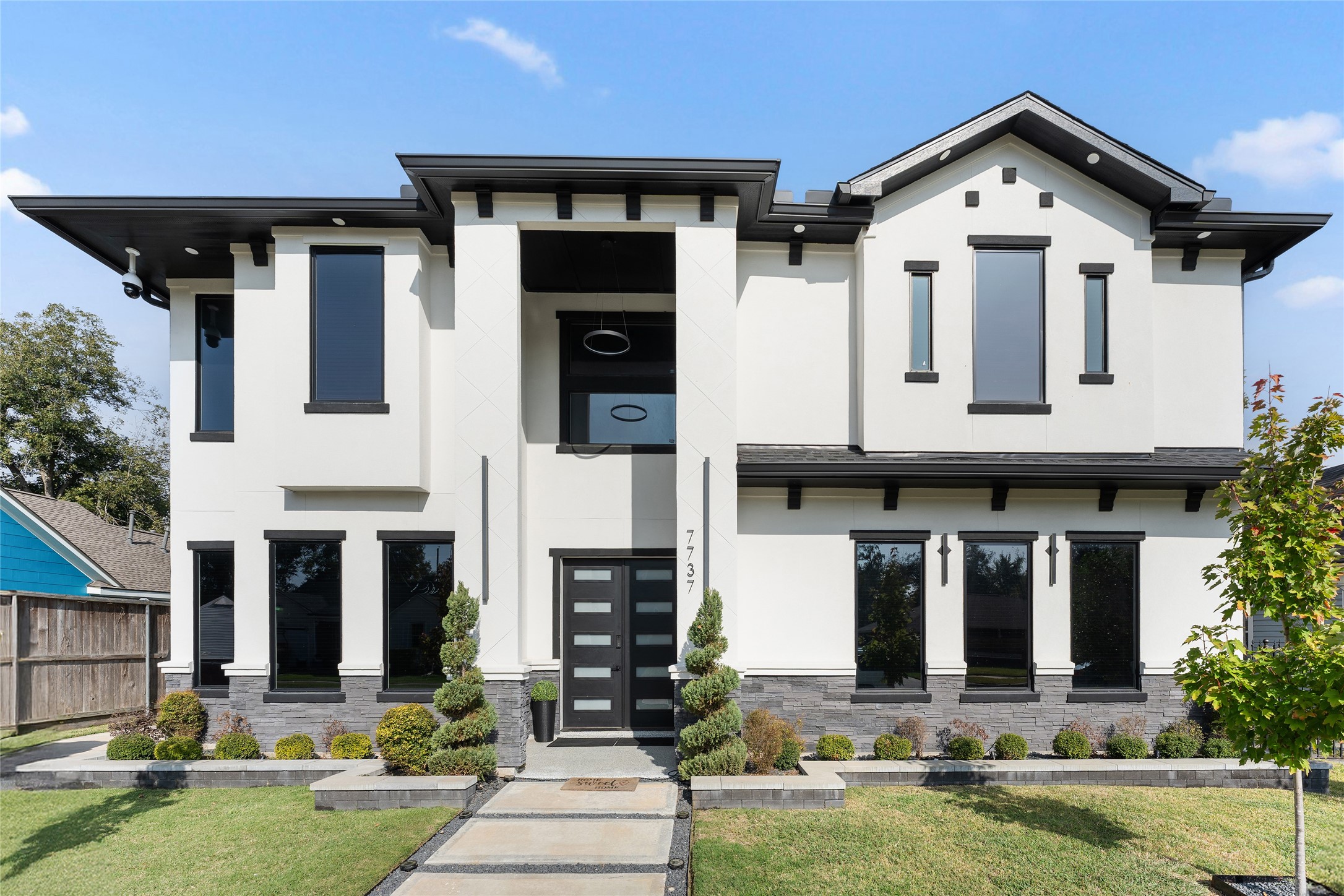 7737 Edna Street Houston, TX 77087 - Photo 2 of 43 a front view of a house with garden