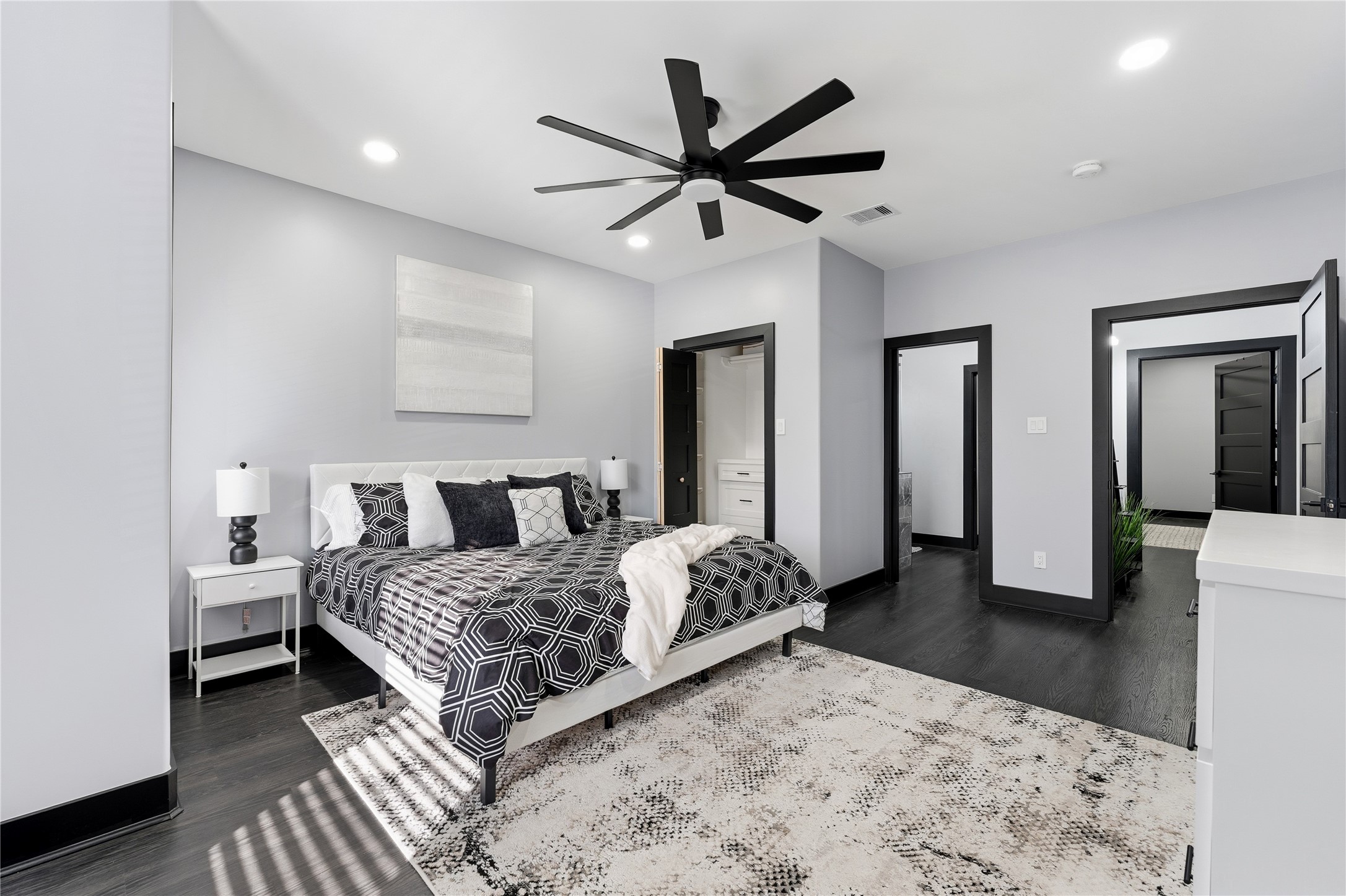 7737 Edna Street Houston, TX 77087 - Photo 24 of 43 a bedroom with a bed and a large mirror