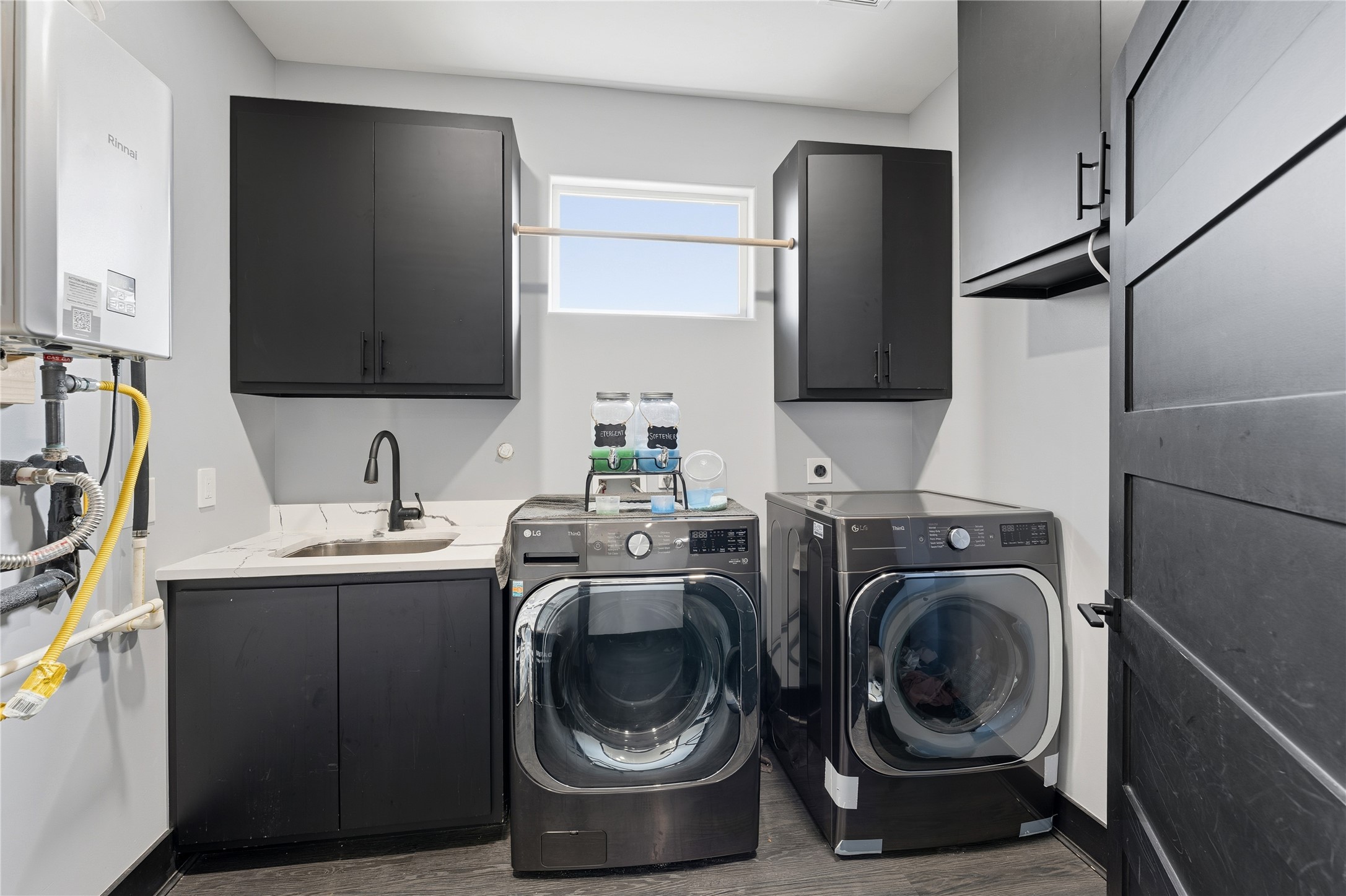 7737 Edna Street Houston, TX 77087 - Photo 30 of 43 a view of a storage and utility room with washer and dryer
