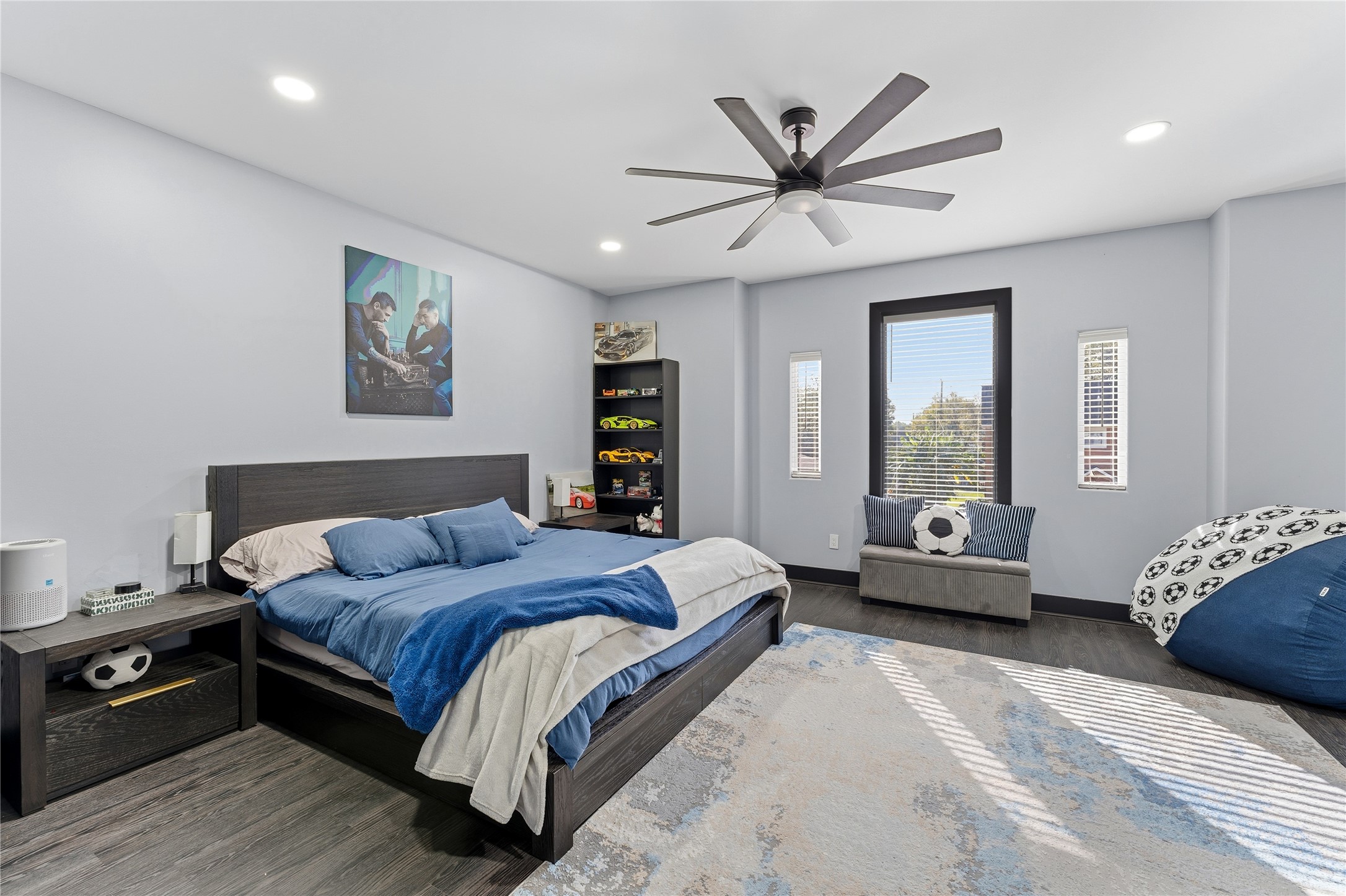 7737 Edna Street Houston, TX 77087 - Photo 31 of 43 a bedroom with a bed and a chandelier