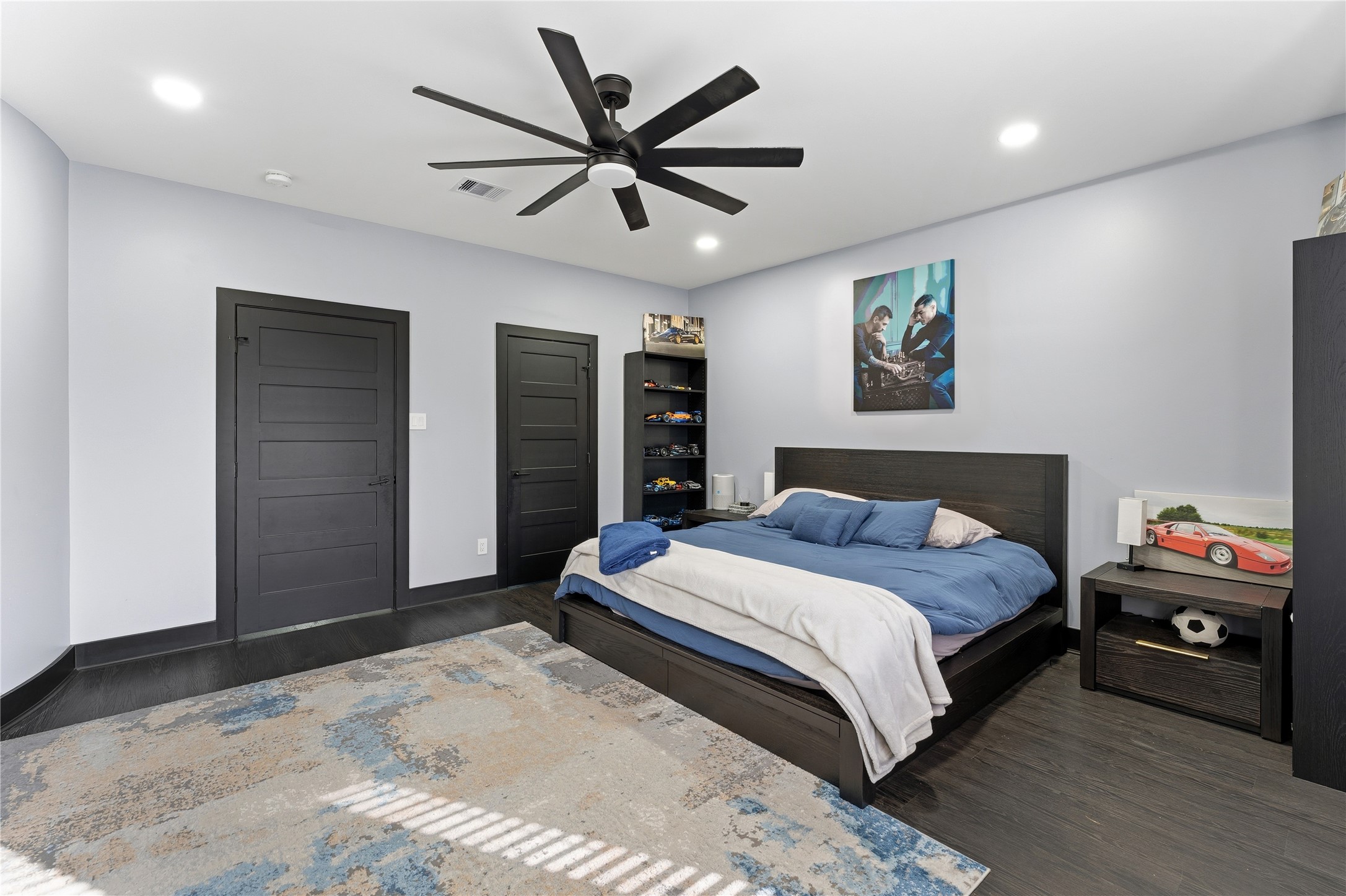 7737 Edna Street Houston, TX 77087 - Photo 32 of 43 a bedroom with a bed and a ceiling fan