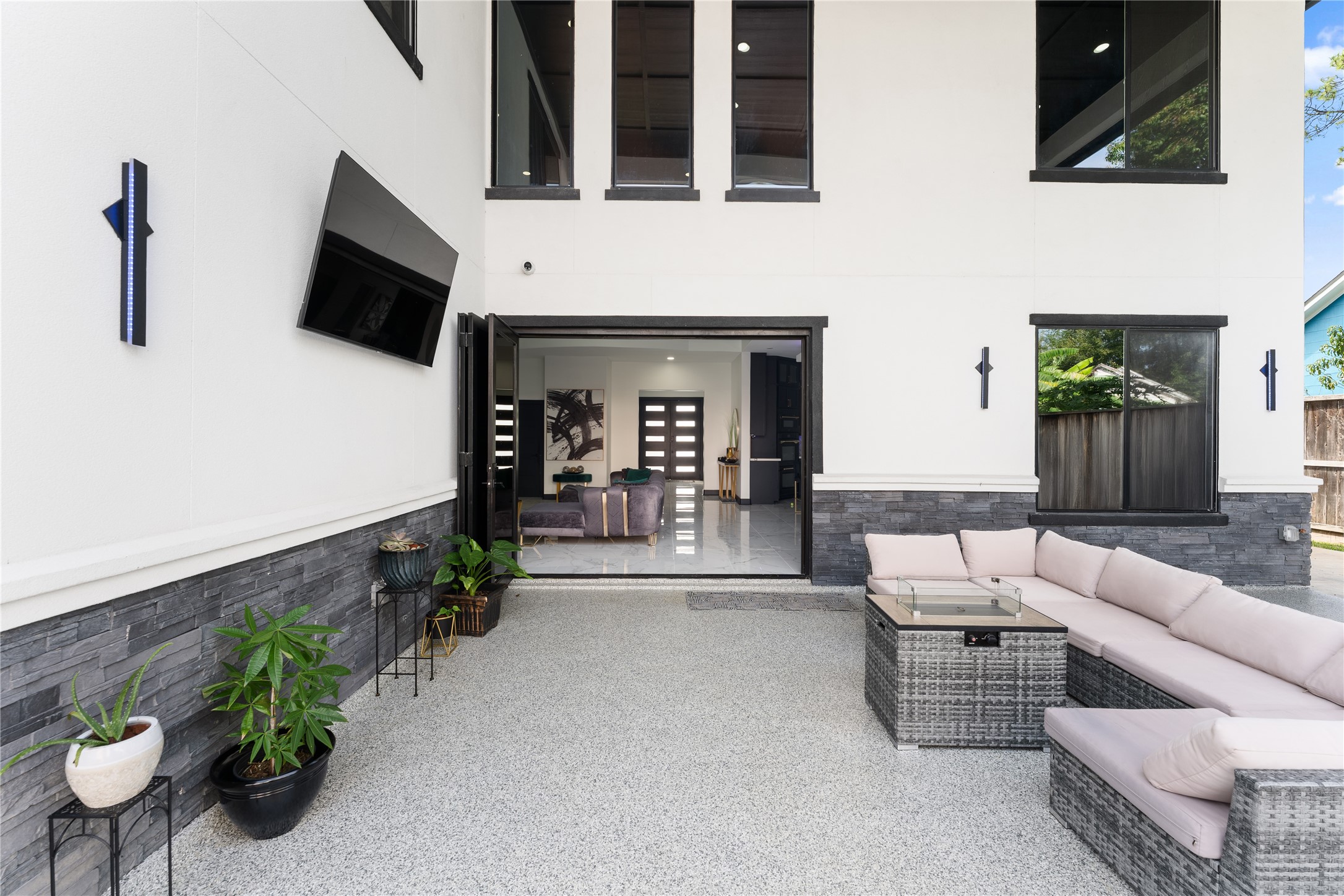 7737 Edna Street Houston, TX 77087 - Photo 42 of 43 a living room with furniture and a flat screen tv