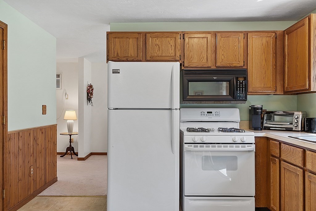 20 Rhodes Road Princeton, MA 01541 - Photo 14 of 35 a kitchen with a refrigerator stove and microwave